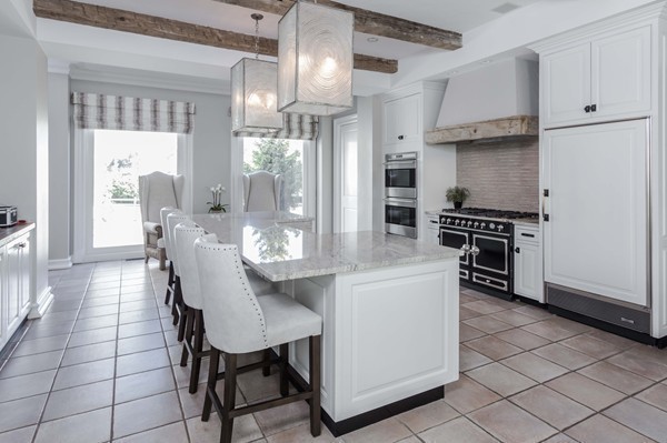 4 Summit Road Weston, MA 02493 - Photo 13 of 30 a kitchen with stainless steel appliances kitchen island granite countertop furniture and a refrigerator