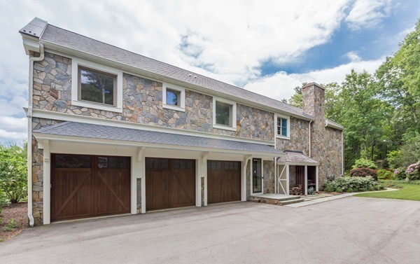 4 Summit Road Weston, MA 02493 - Photo 21 of 30 a front view of a house with a garage