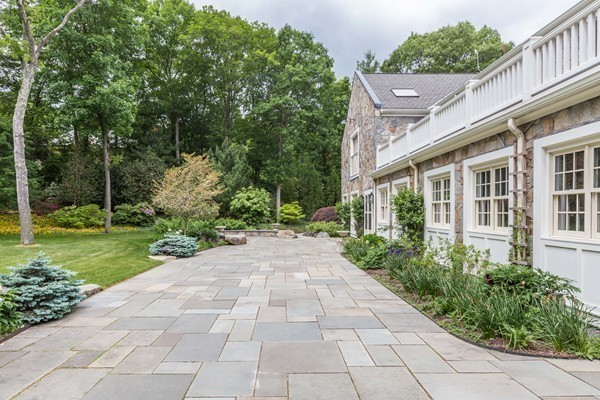 4 Summit Road Weston, MA 02493 - Photo 23 of 30 a view of a yard with plants and large trees