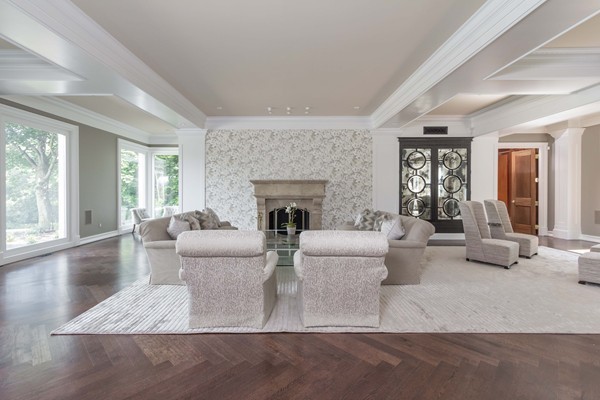 4 Summit Road Weston, MA 02493 - Photo 10 of 30 a living room with couches and a fireplace
