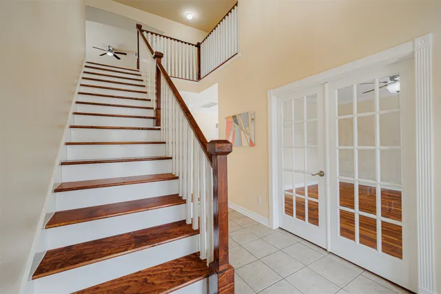 a view of entryway with stairs and windows