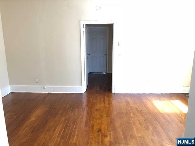 82 Park Avenue, Unit 1 Rutherford, NJ 07070 - Photo 5 of 6 a view of a hallway with wooden floor