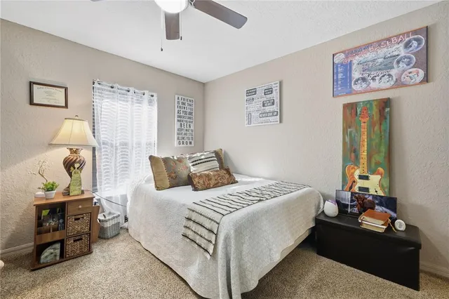 a bedroom with a bed and furniture