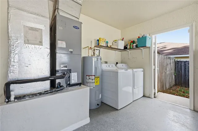 a utility room with dryer and washer