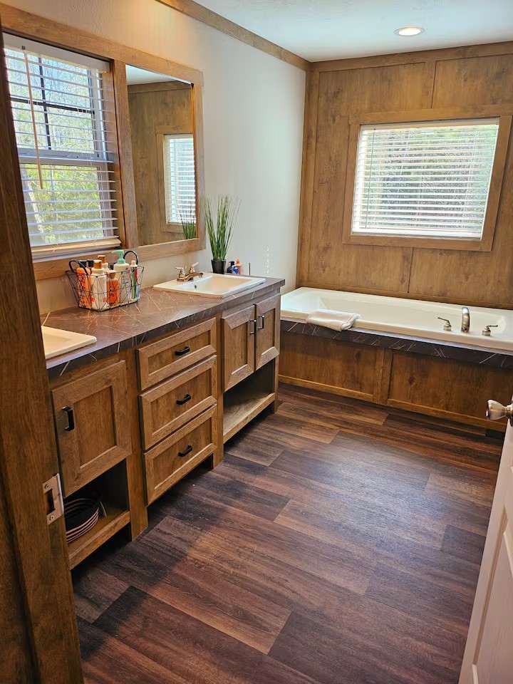 105 Saddle Surrey Road Coldspring, TX 77331 - Photo 31 of 48 a bathroom with a sink and a large mirror