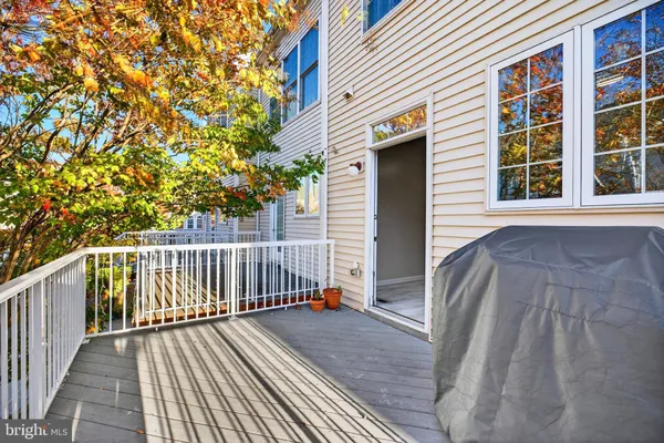 a view of balcony with wooden floor