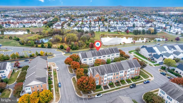 an aerial view of a house with a ocean view