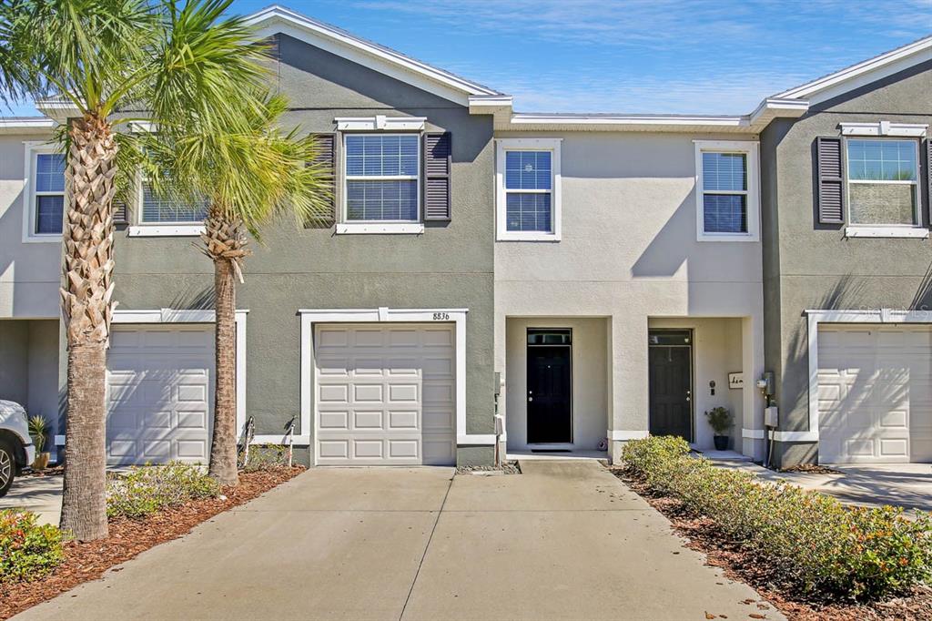 8836 Indigo Trail Loop Riverview, FL 33578 - Photo 1 of 1 a front view of a house with a garden