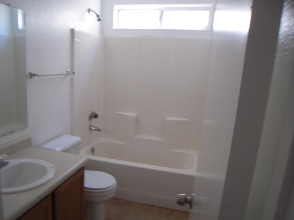 8423 West Almeria Road Phoenix, AZ 85037 - Photo 3 of 3 a bathroom with a sink and a mirror