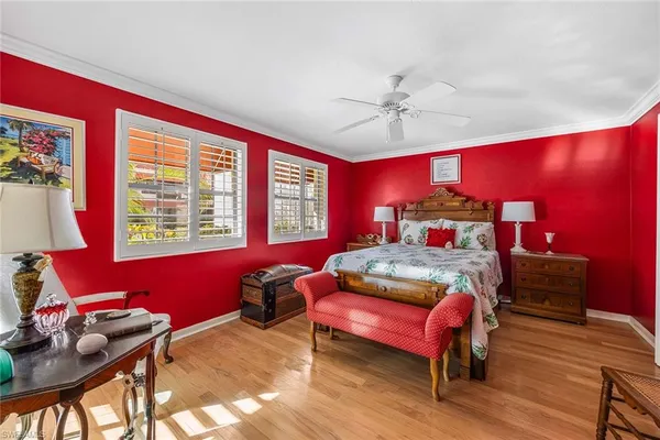 a bedroom with furniture and a window