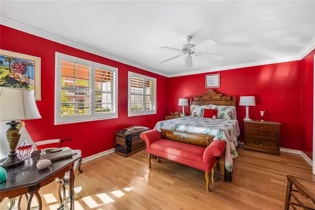 a bedroom with furniture and a window