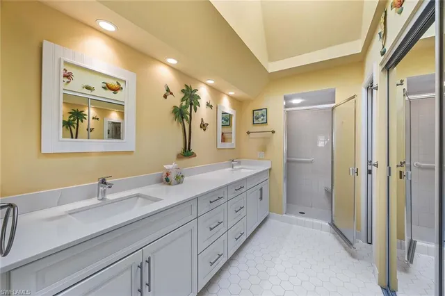 a spacious bathroom with double sink and a mirror