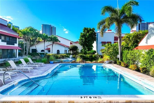 a view of pool with outdoor seating
