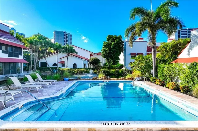 a view of pool with outdoor seating