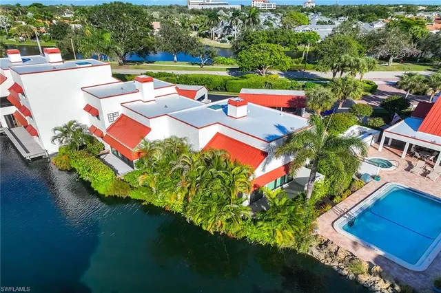 an aerial view of a residential houses with outdoor space and street view