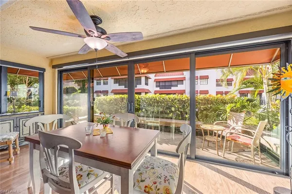 a view of a dining room with furniture window and outside view