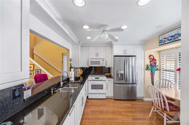 a kitchen with stainless steel appliances a stove a refrigerator and a refrigerator