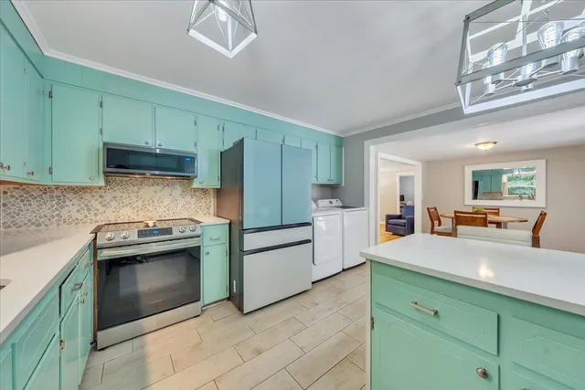 a kitchen with a stove a sink and dishwasher