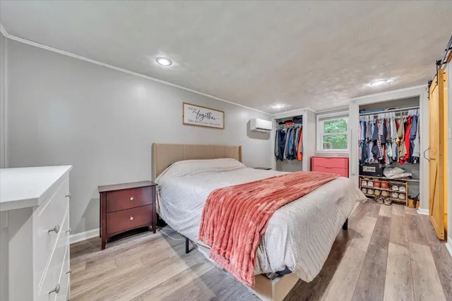 a bathroom with a sink a toilet a mirror and shower