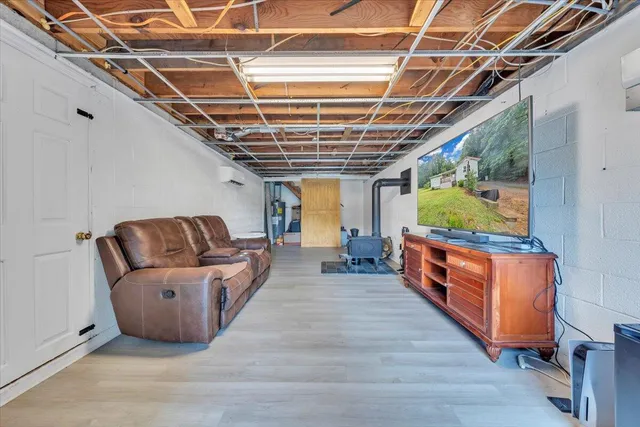 a living room with furniture and large windows