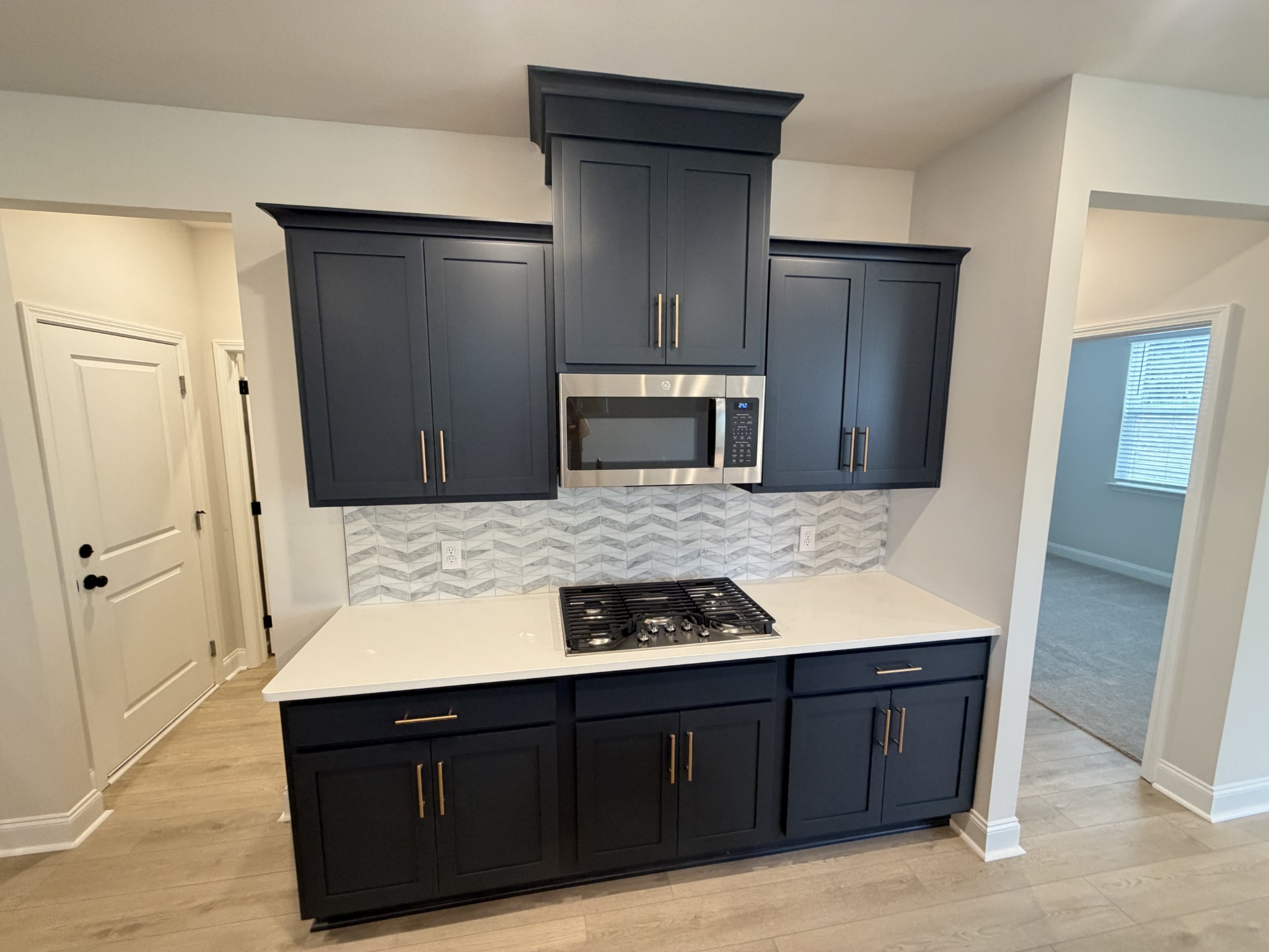 147 Emeline Way Mount Juliet, TN 37122 - Photo 10 of 41 a kitchen with a refrigerator and a stove