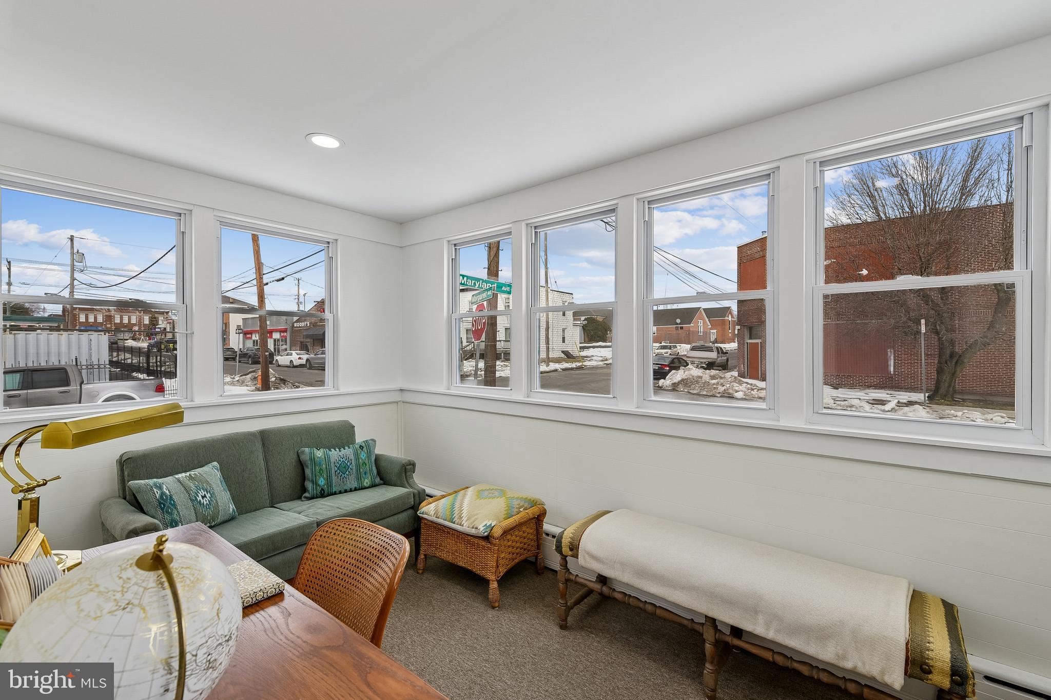 100 Margaret Avenue Baltimore, MD 21221 - Photo 12 of 44 a living room with furniture and a large window