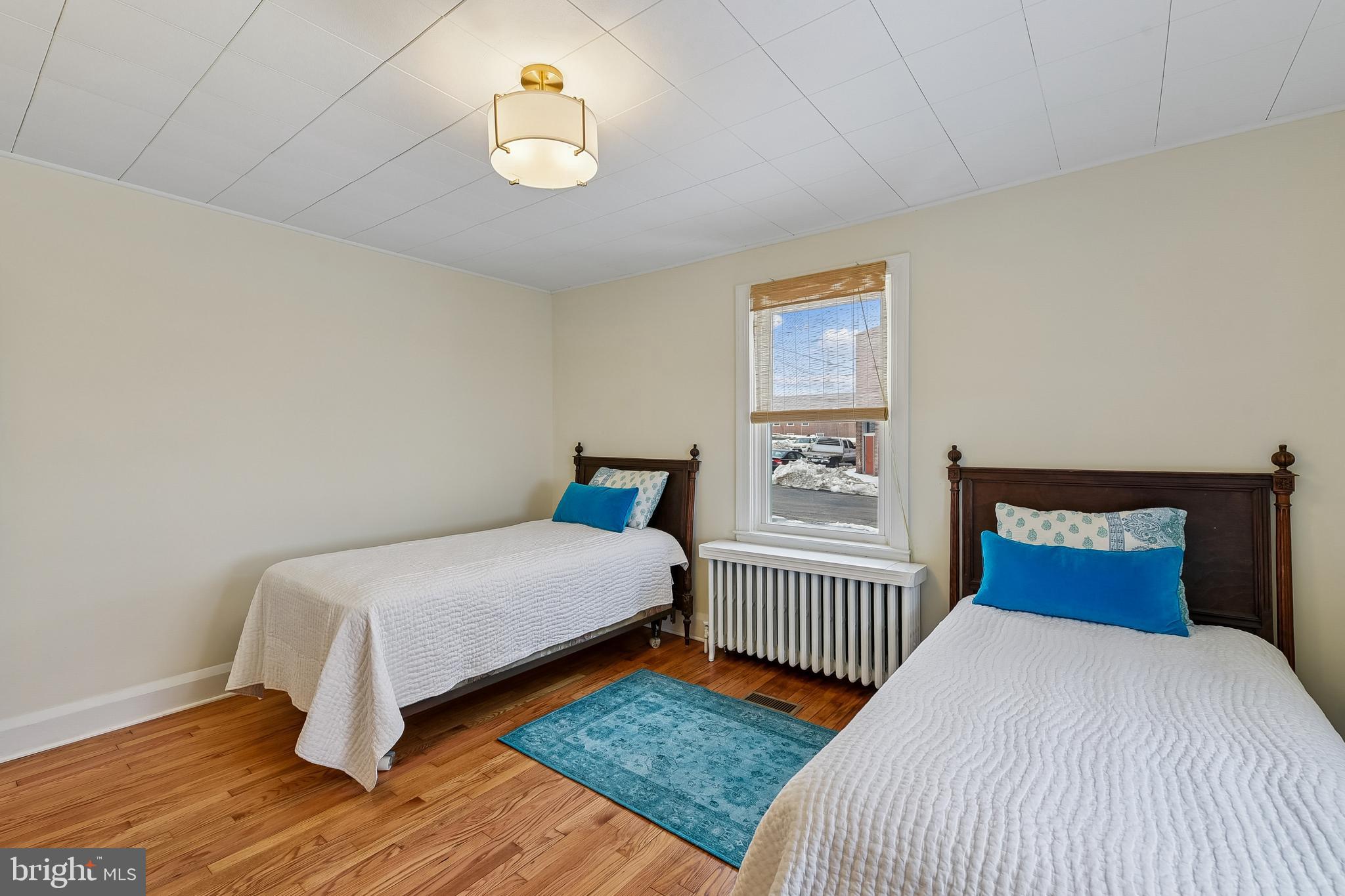 100 Margaret Avenue Baltimore, MD 21221 - Photo 21 of 44 a bedroom with a bed and a window
