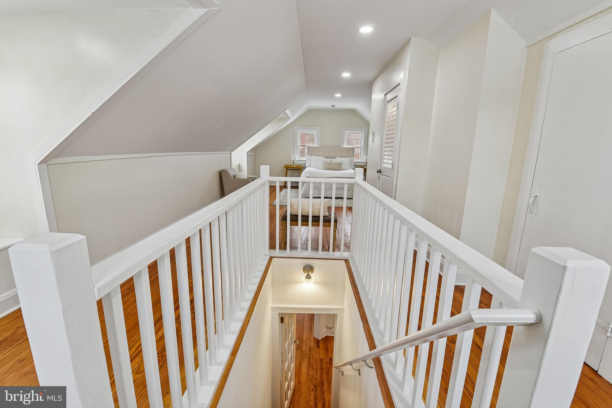 100 Margaret Avenue Baltimore, MD 21221 - Photo 22 of 44 a view of staircase with wooden floor and fan