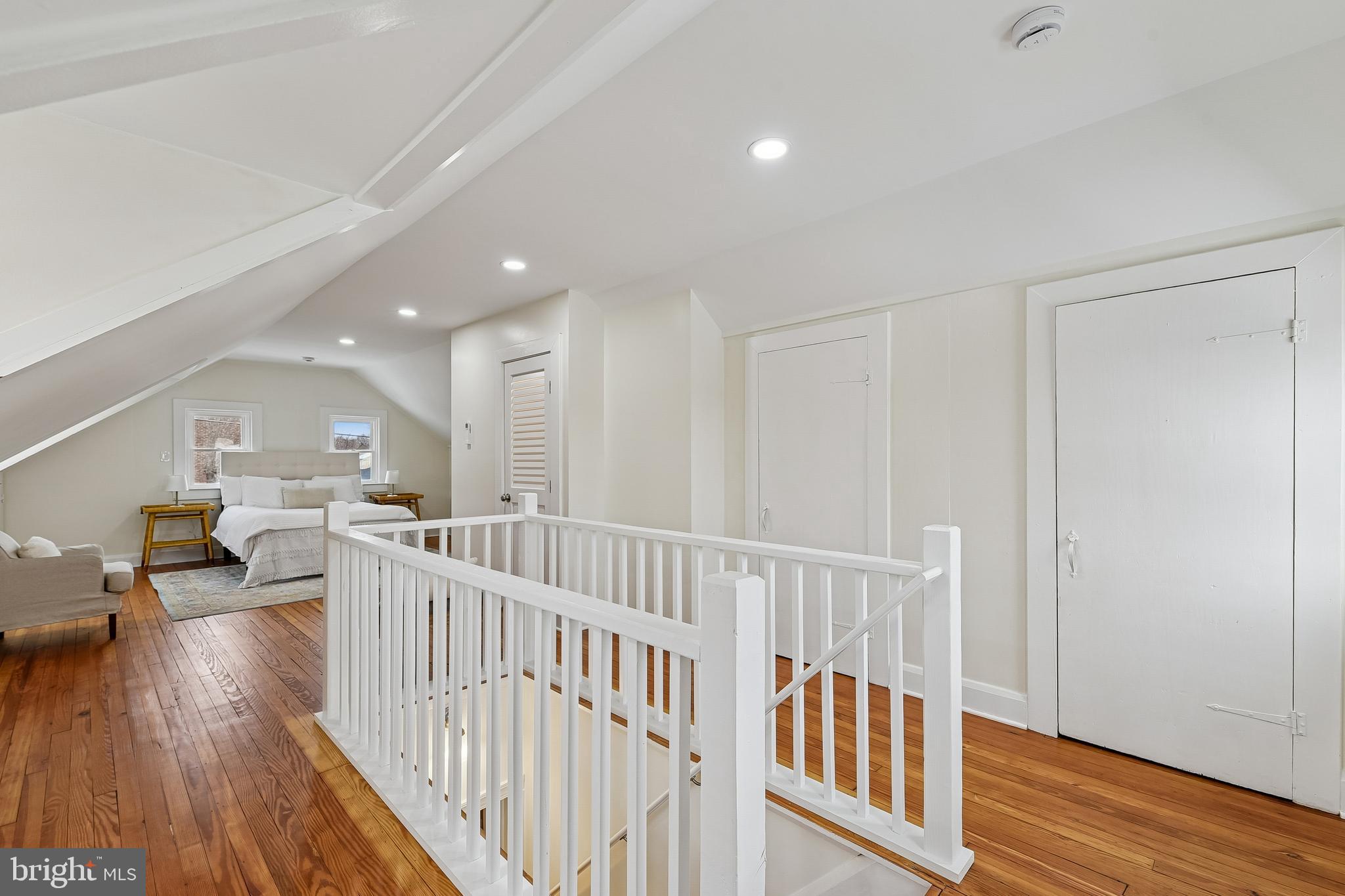 100 Margaret Avenue Baltimore, MD 21221 - Photo 23 of 44 a view of a hallway with dining room and wooden floor