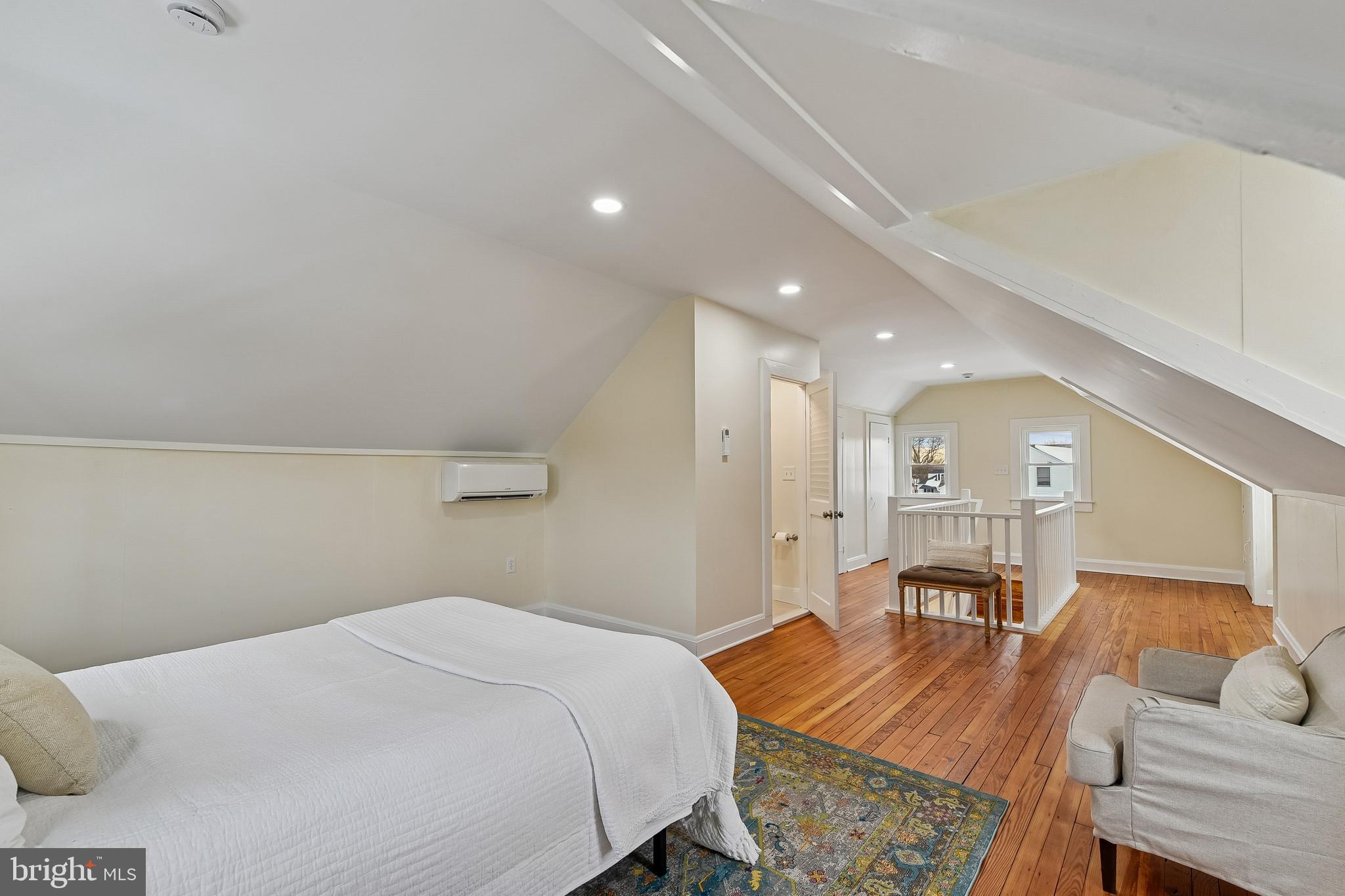 100 Margaret Avenue Baltimore, MD 21221 - Photo 27 of 44 a bedroom with a bed and wooden floor