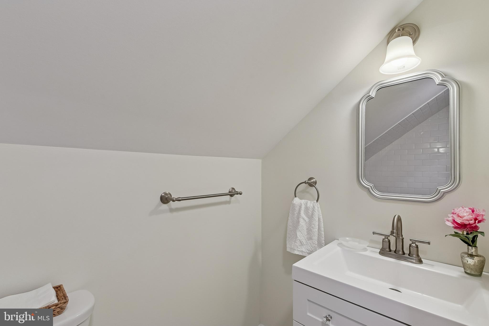 100 Margaret Avenue Baltimore, MD 21221 - Photo 29 of 44 a bathroom with a sink and a mirror