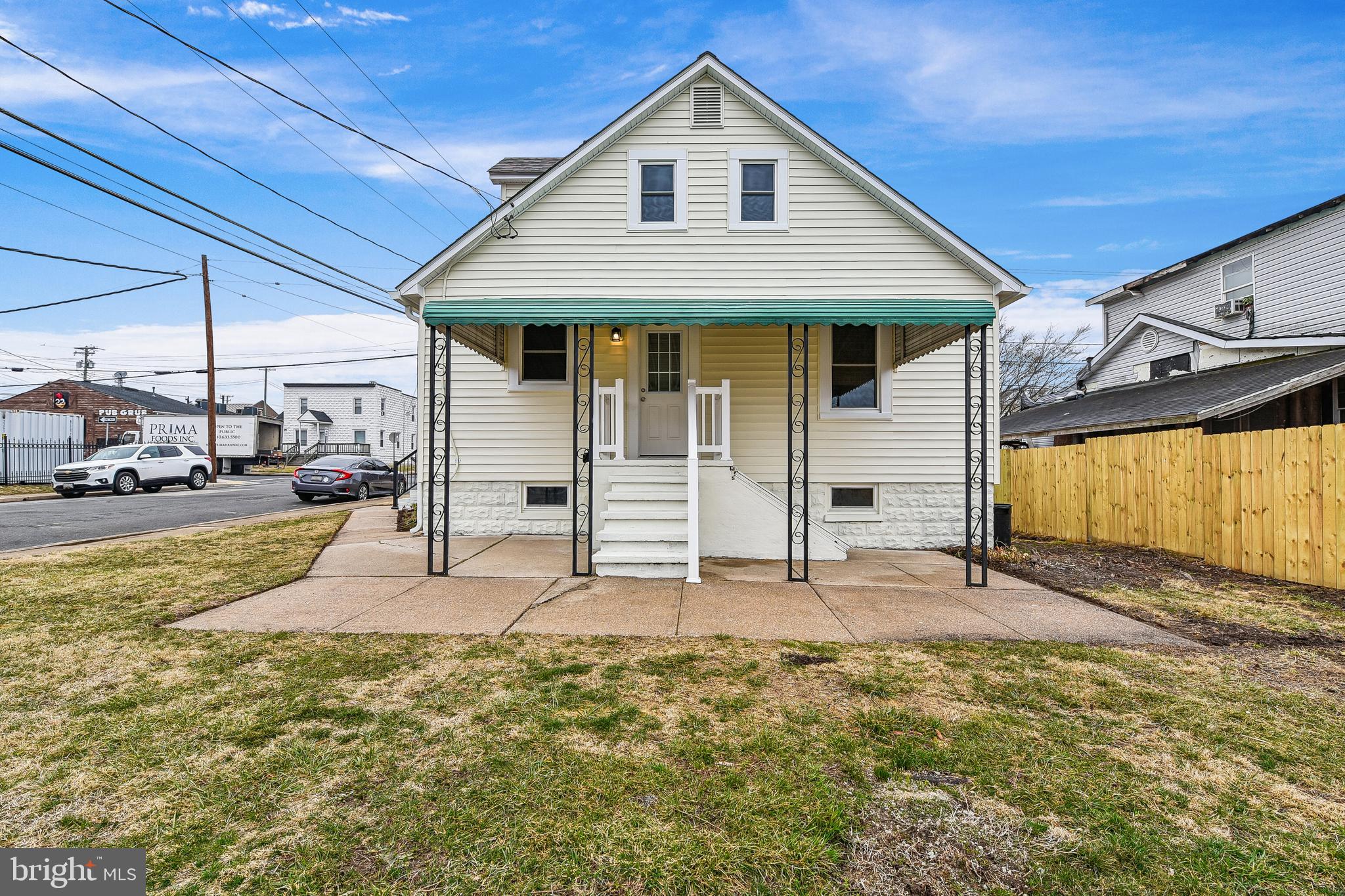100 Margaret Avenue Baltimore, MD 21221 - Photo 43 of 44 a front view of a house with a yard