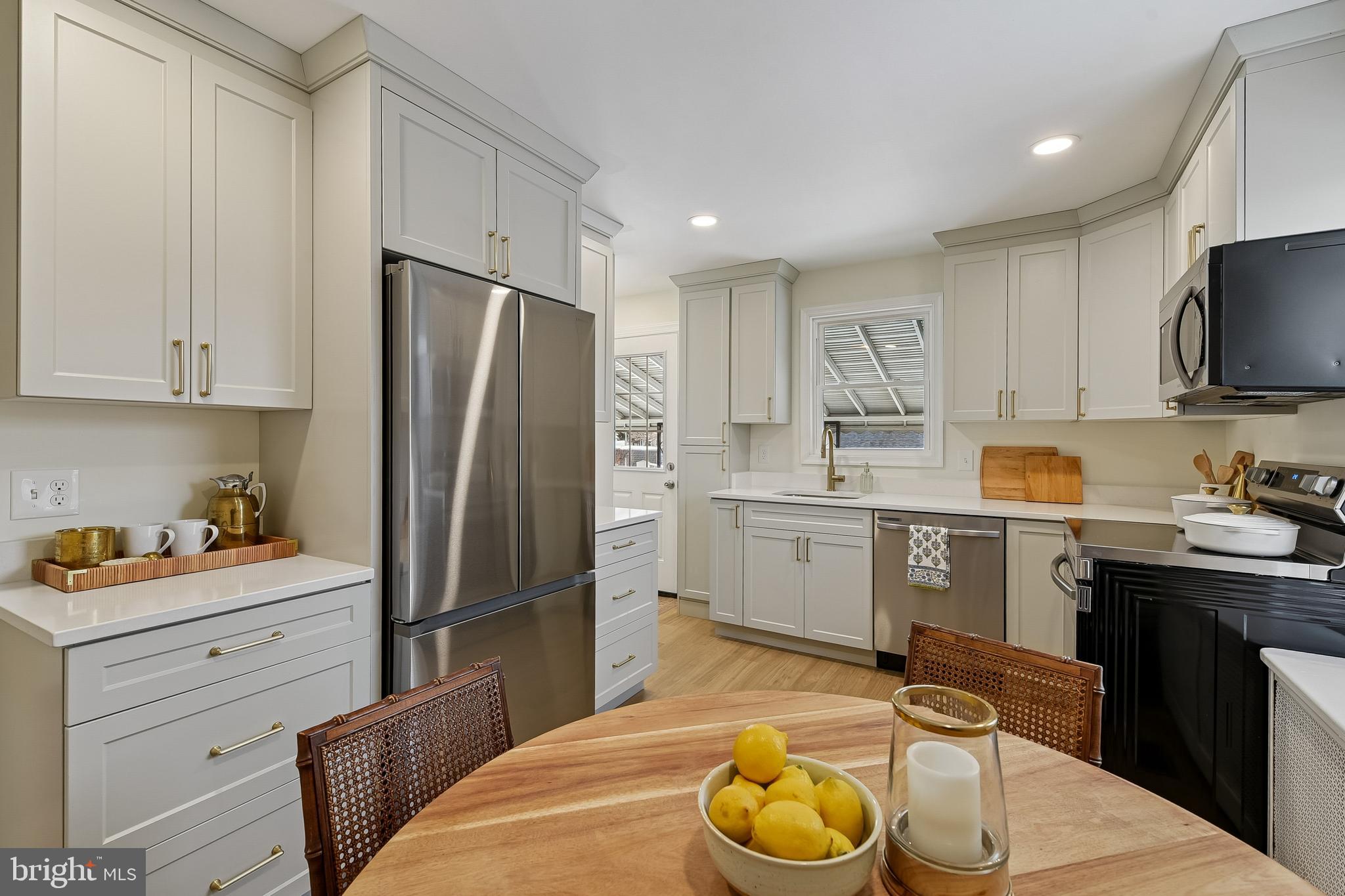 100 Margaret Avenue Baltimore, MD 21221 - Photo 9 of 44 a kitchen with a refrigerator and a stove top oven