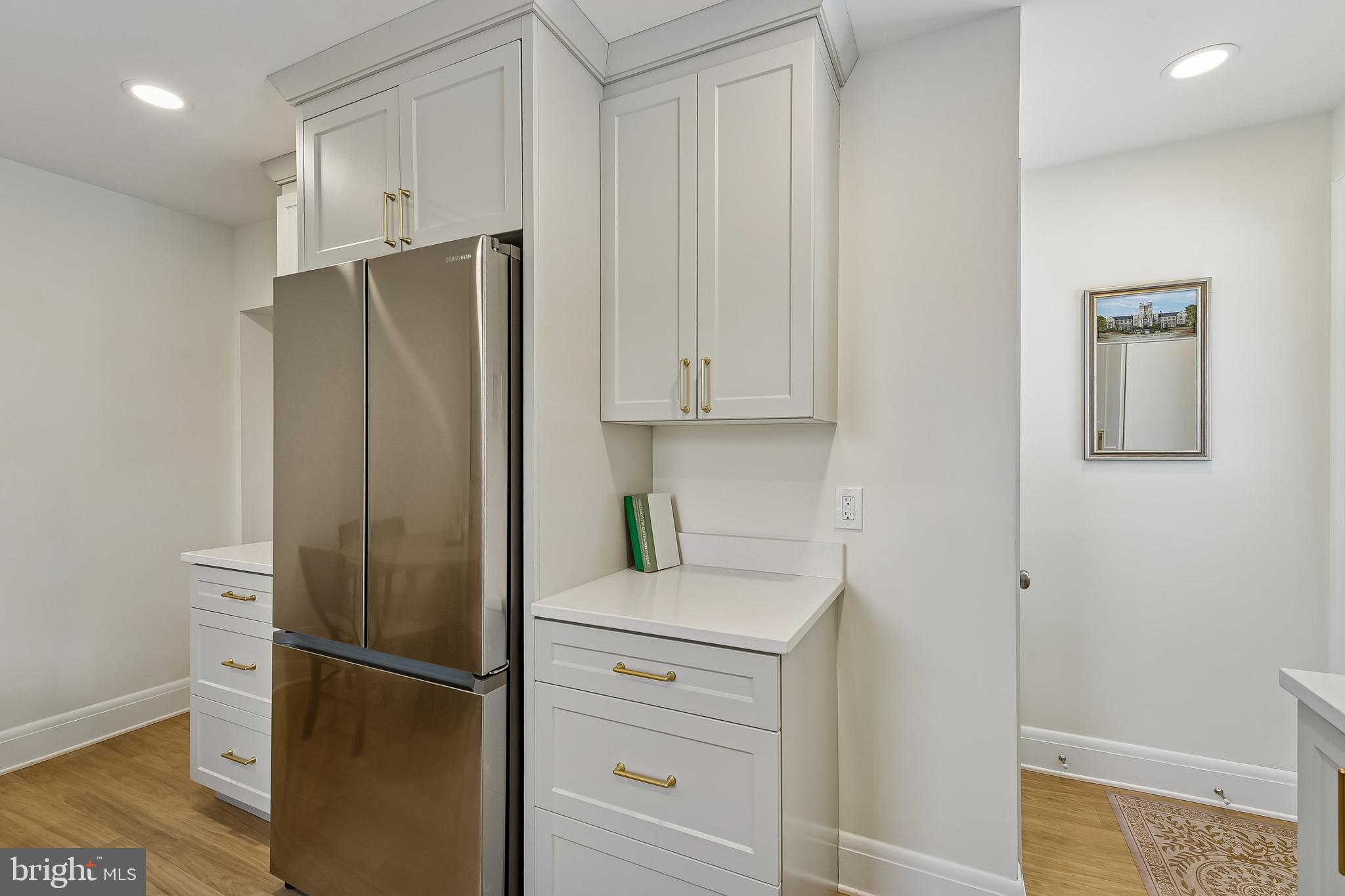 100 Margaret Avenue Baltimore, MD 21221 - Photo 10 of 44 a kitchen with a refrigerator and cabinets