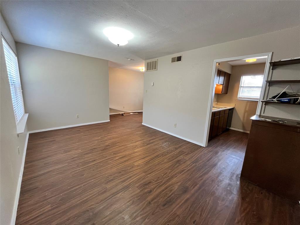 2526 West Prairie Street, Unit 108 Denton, TX 76201 - Photo 9 of 12 Here is a different view of the living area. Notice all of the natural lighting coming from the windows.