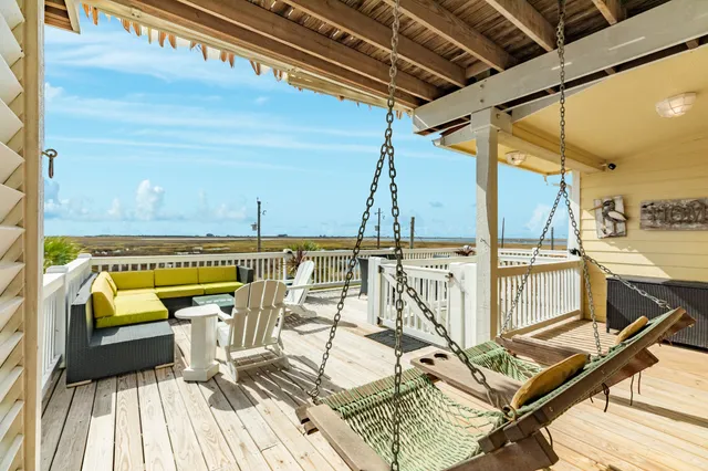 a view of swimming pool with seating area