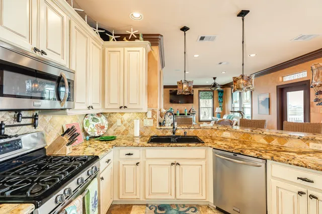 a bathroom with a granite countertop shower a mirror and a sink