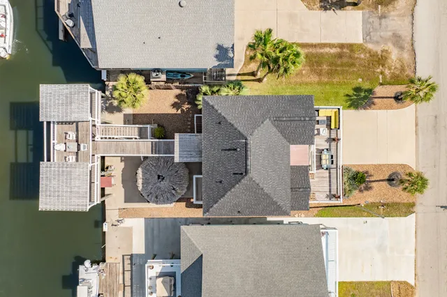 an aerial view of residential houses with outdoor space