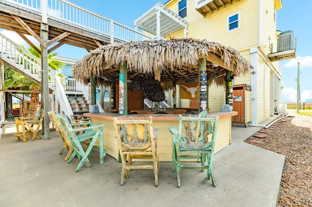 a view of a chairs and table in the patio