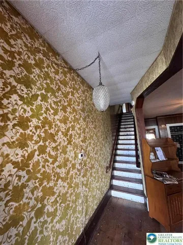 a view of entryway with stairs