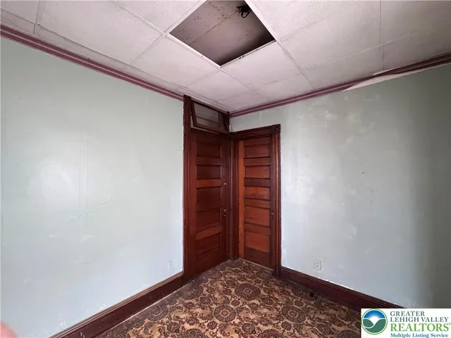 a view of an empty room and a window