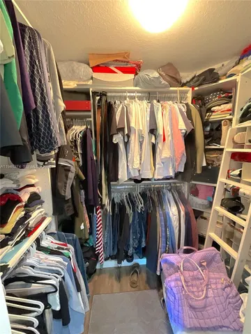 a spacious bathroom with a double vanity sink and a mirror