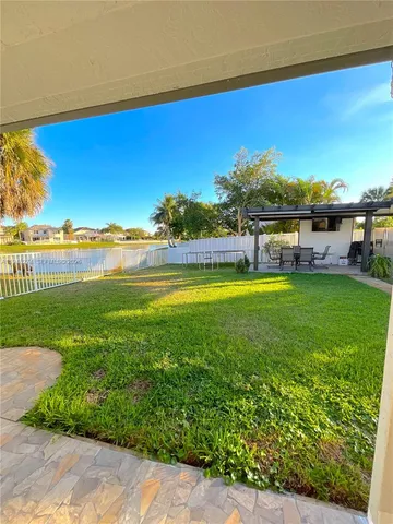 a view of a house with a big yard