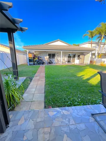 a view of a garden and lake
