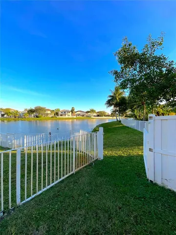 a view of a street with a garden