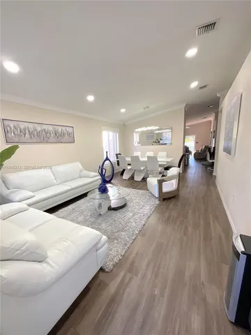 a view of a living room and dining room