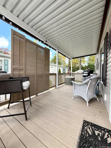 a building outdoor space with patio furniture and potted plants