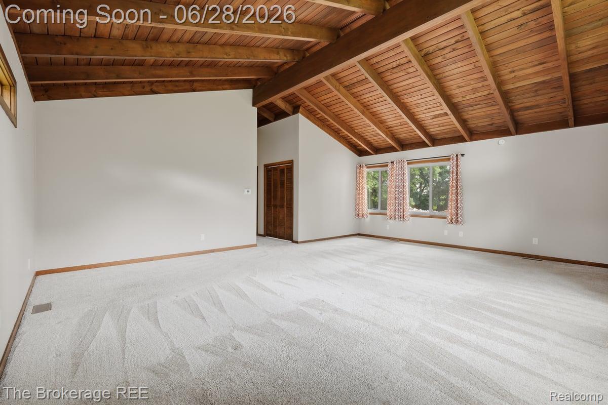 8475 Knox Road Clarkston, MI 48348 - Photo 31 of 71 Vaulted wood-plank ceiling with exposed beams