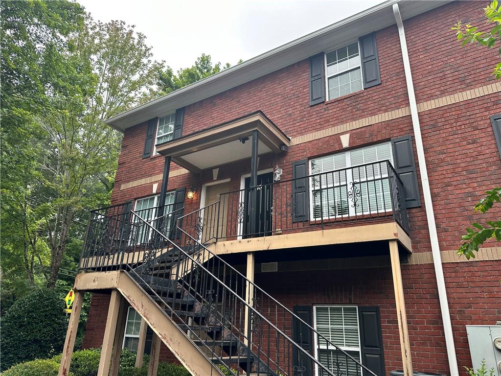 105 Whitehead Road, Unit 10 Athens, GA 30606 - Photo 15 of 16 a front view of a house with a tree