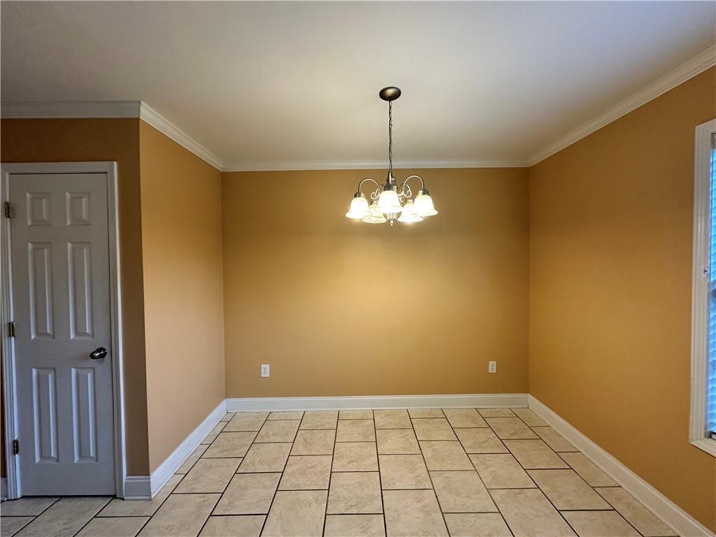 105 Whitehead Road, Unit 10 Athens, GA 30606 - Photo 6 of 16 a view of empty room with windows